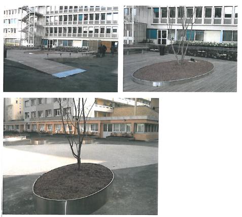 Jardinières rondes, bancs et corbeilles en métal et bois sur une place